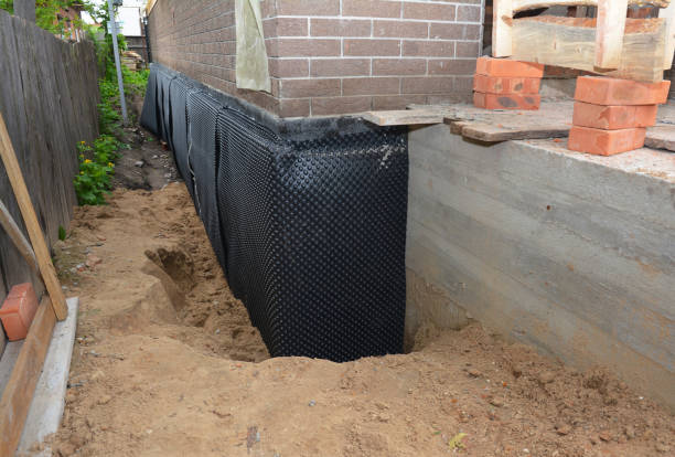 Happy homeowners after waterproofing job in Coden